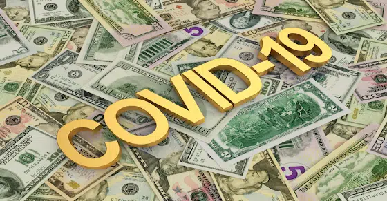 Pile of money with the words "Covid-19"