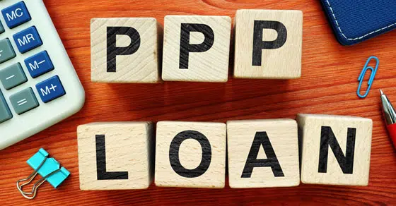 Wood blocks spelling out PPP loan